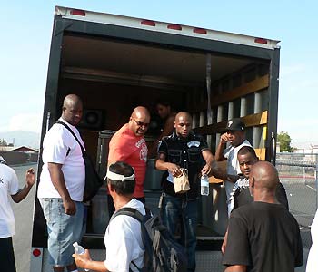 Floyd Mayweather Jr. hands out lunches to homeless Las Vegans on a sweltering desert summer day. Kevin Iole photo
